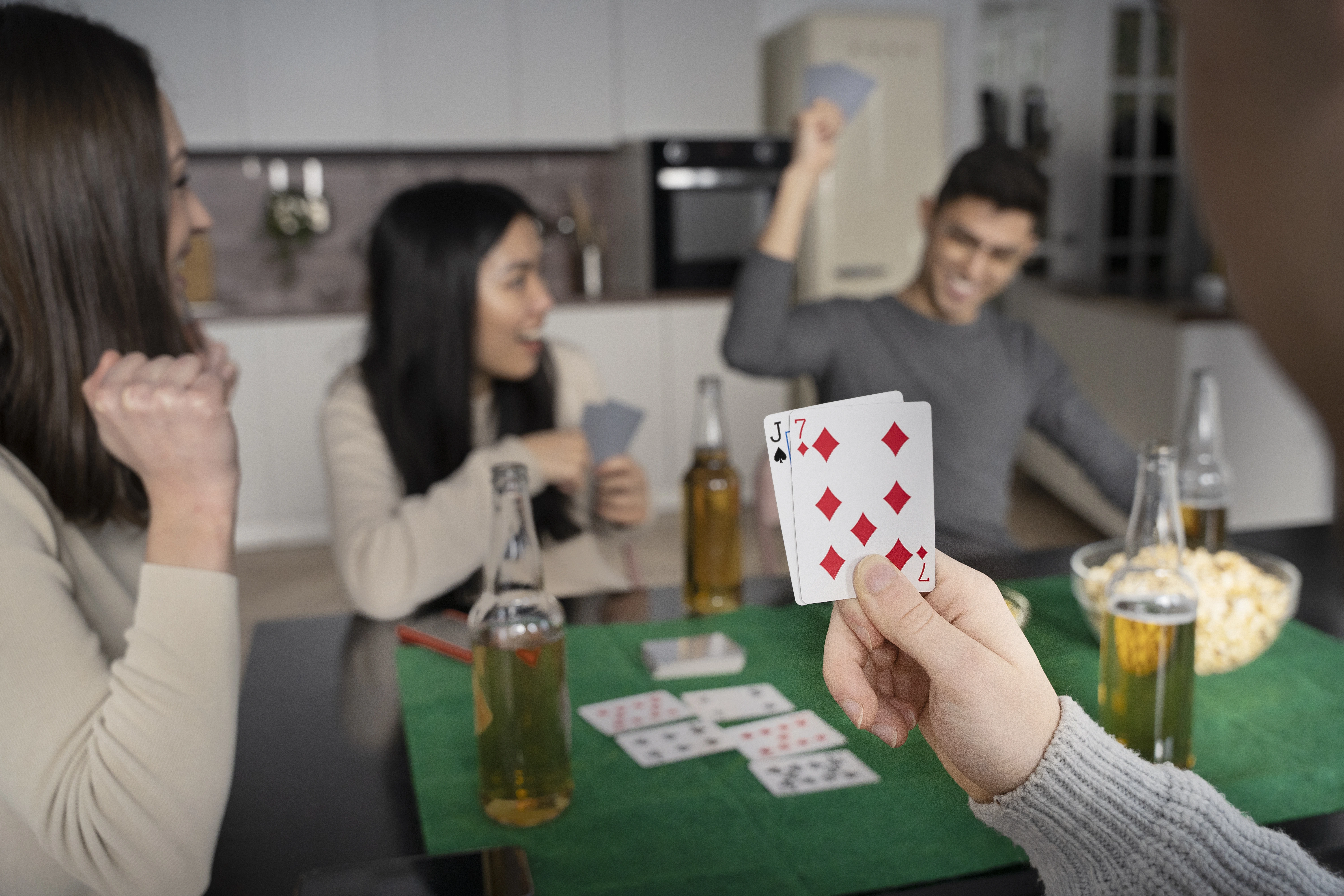 A group of friends playing black Jack together showing excitement and happiness together